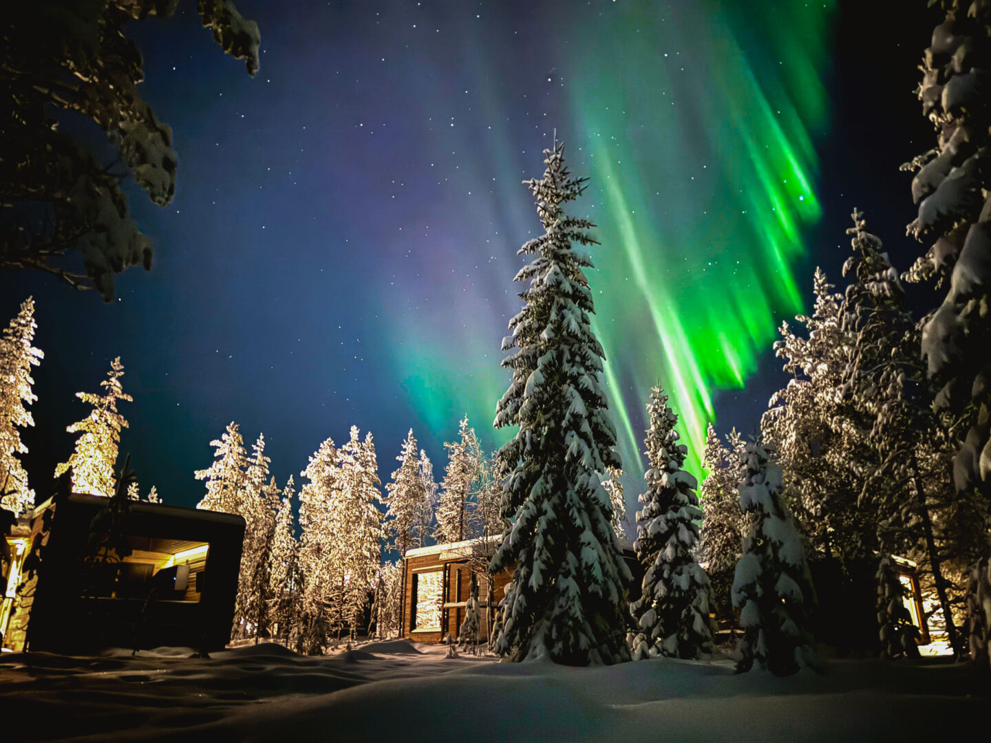 Northern Lights above the snowy resort