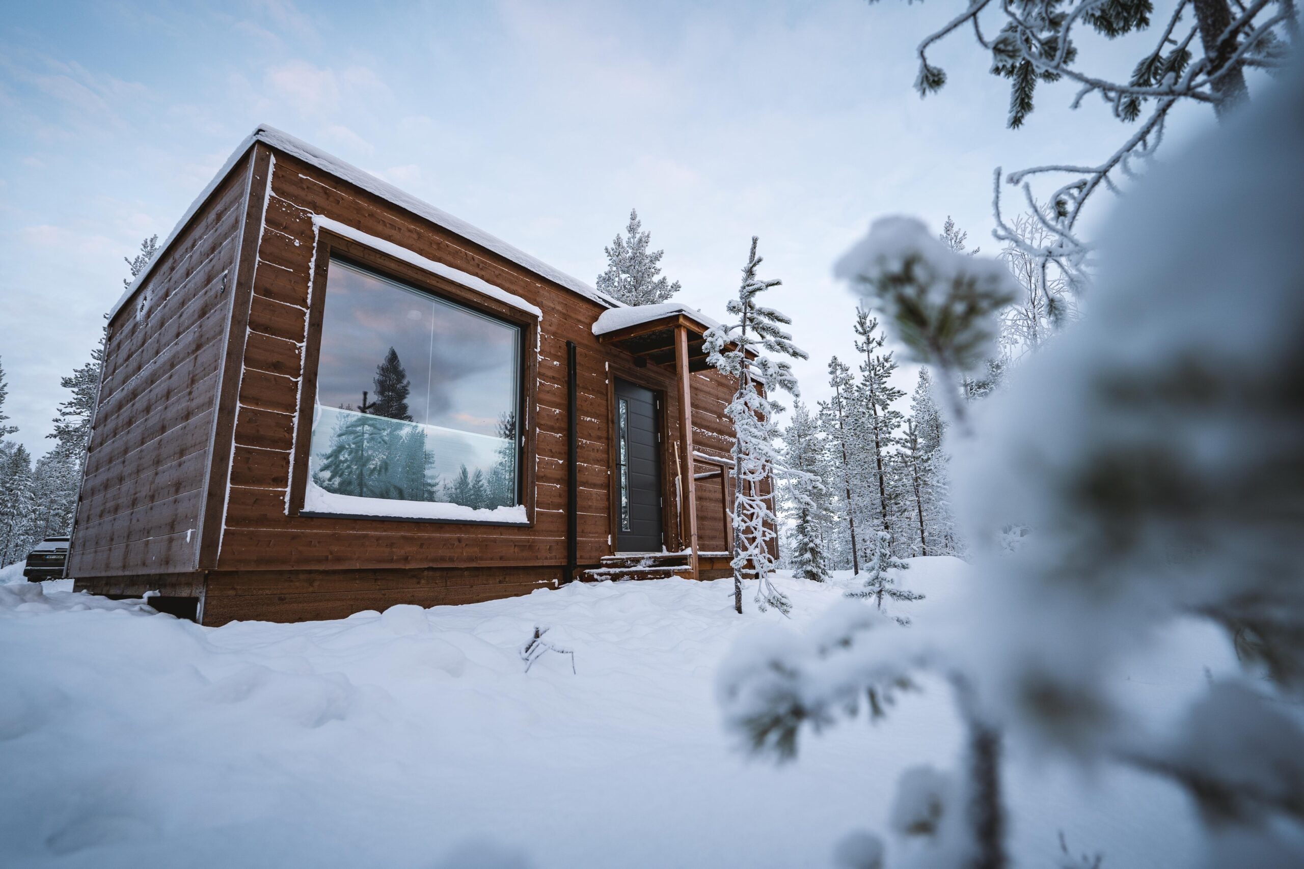Snow-covered cabins at Aurora Hill Resort